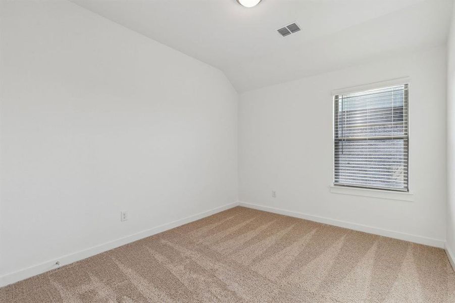 Bedroom in the Oak II home plan by Trophy Signature Homes – REPRESENTATIVE PHOTO