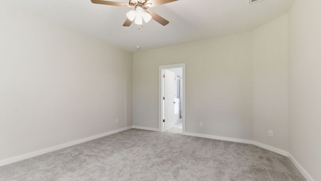 Bedroom with carpet and ceiling fan Bedroom with carpet and ceiling fan