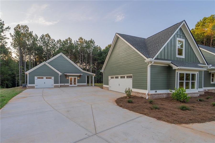 Front exterior of a new home in , Social Circle, GA, highlighting curb appeal (Image 27).