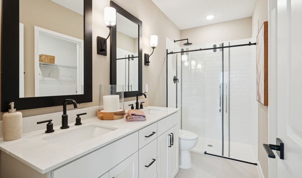 Primary bath with dual sinks and glass shower