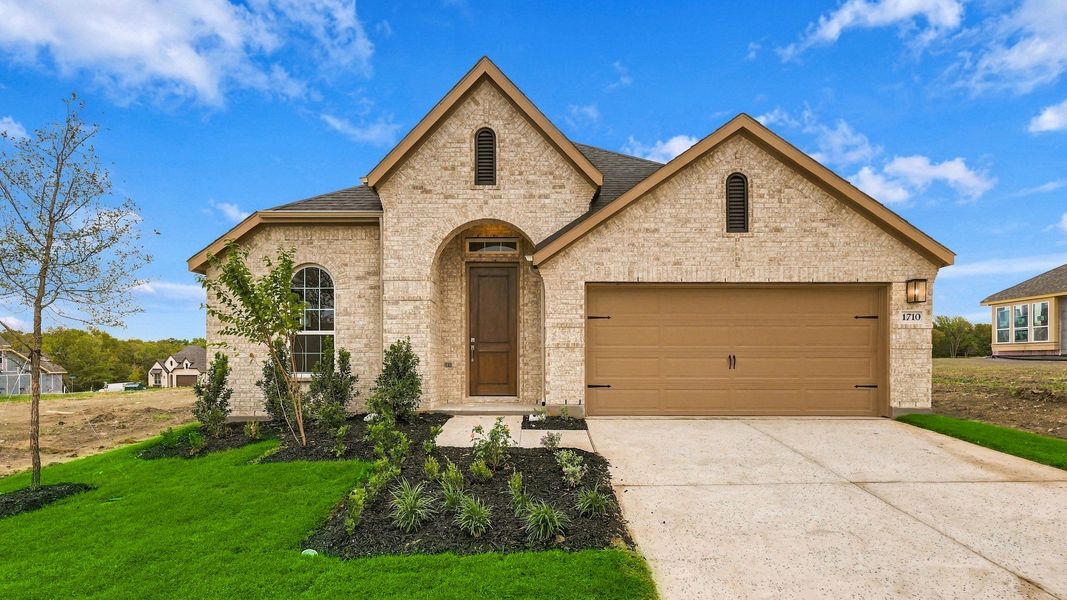 Front exterior of a new home in Thompson Farms, Van Alstyne, TX, highlighting curb appeal (Image 2). Front exterior of a new home in Thompson Farms, Van Alstyne, TX, highlighting curb appeal (Image 2).