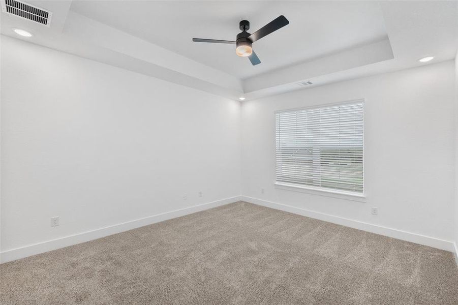 Primary bedroom with carpet Primary bedroom with carpet
