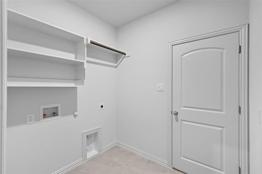 Washroom with electric dryer hookup, washer hookup, and gas dryer hookup Washroom with electric dryer hookup, washer hookup, and gas dryer hookup