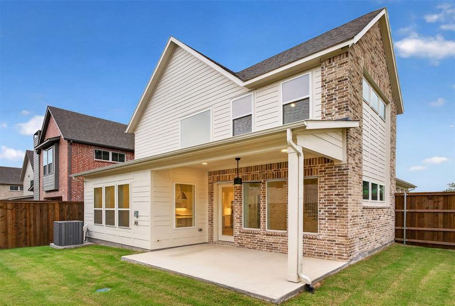 Rear exterior featuring a covered patio, brick and siding facade, and multiple windows Rear exterior featuring a covered patio, brick and siding facade, and multiple windows