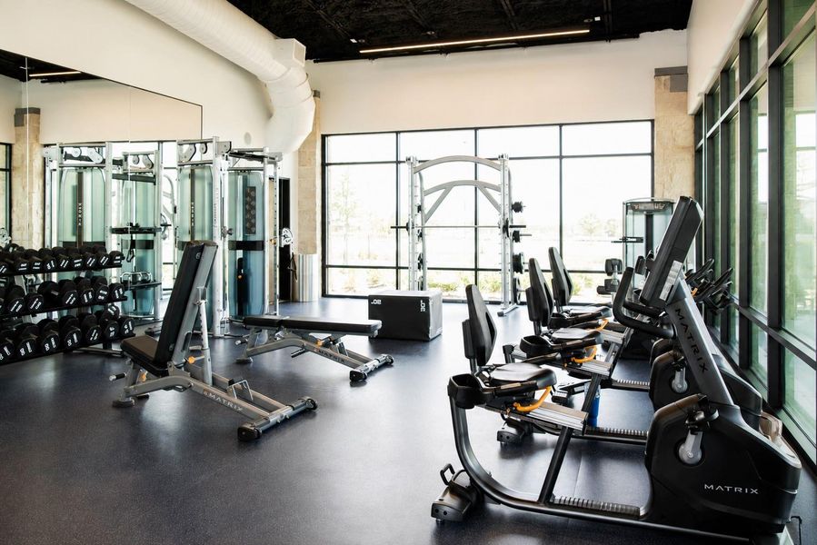 Stay active without leaving the neighborhood! Sunterra's modern fitness center features a wide variety of strength and cardio equipment in a bright, spacious setting with floor-to-ceiling windows overlooking the community amenities. Stay active without leaving the neighborhood! Sunterra's modern fitness center features a wide variety of strength and cardio equipment in a bright, spacious setting with floor-to-ceiling windows overlooking the community amenities.