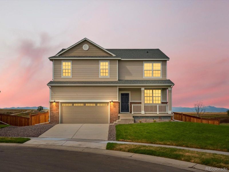 Front exterior of a new home in Buffalo Highlands: The Canyon Collection, Commerce City, CO, highlighting curb appeal (Image 1).