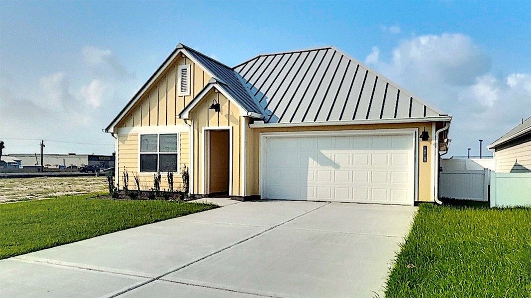 Front exterior of a new home in The Islands of Rockport, Rockport, TX, highlighting curb appeal (Image 2). Front exterior of a new home in The Islands of Rockport, Rockport, TX, highlighting curb appeal (Image 2).