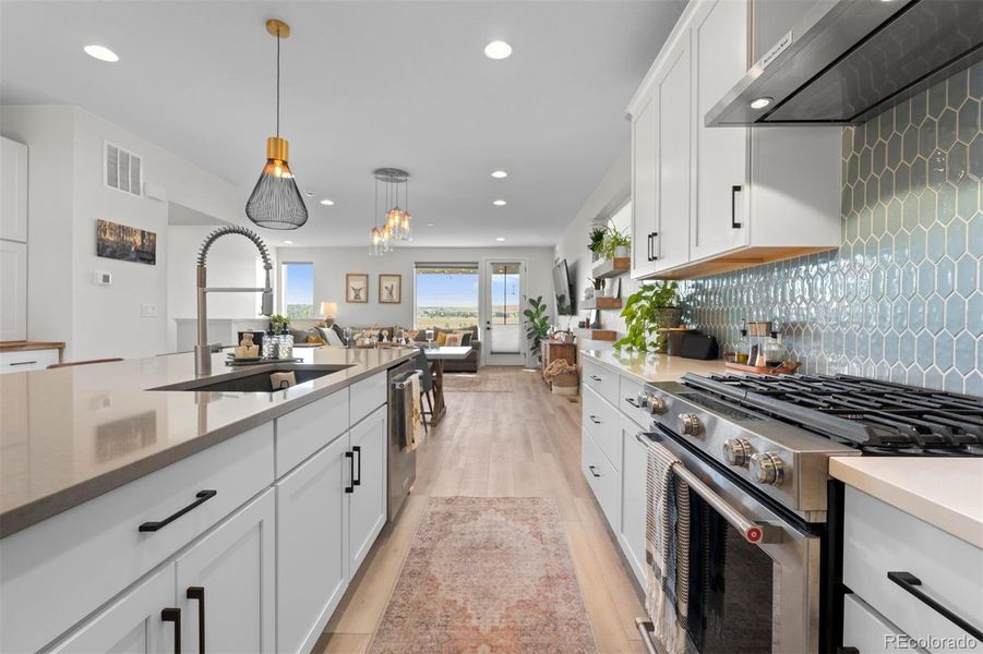 Custom tile backsplash and upgraded gas range