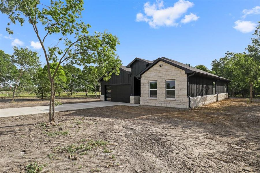 Front exterior of a new home in , Purdon, TX, highlighting curb appeal (Image 24).