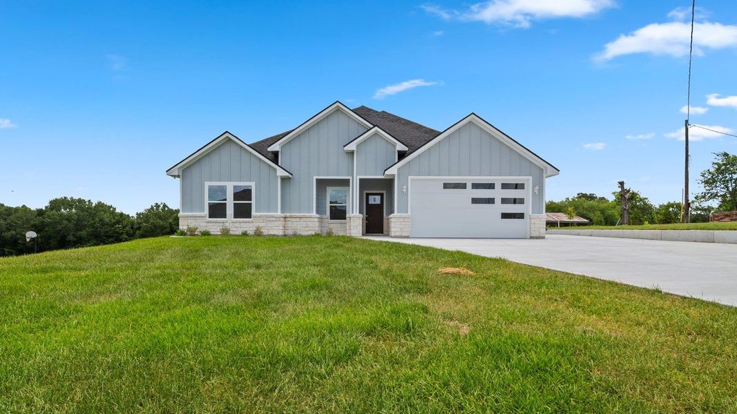 Front exterior of a new home in , Brenham, TX, highlighting curb appeal (Image 19). Front exterior of a new home in , Brenham, TX, highlighting curb appeal (Image 19).