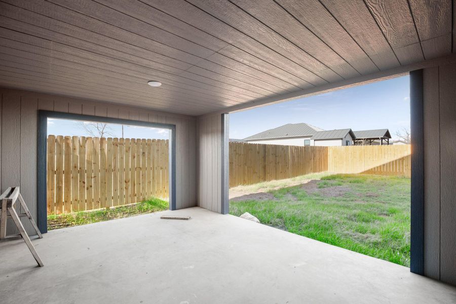 Fenced backyard featuring a patio area