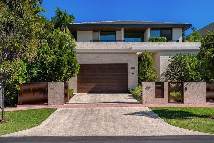 Front exterior of a new home in , Miami Beach, FL, highlighting curb appeal (Image 1). Front exterior of a new home in , Miami Beach, FL, highlighting curb appeal (Image 1).