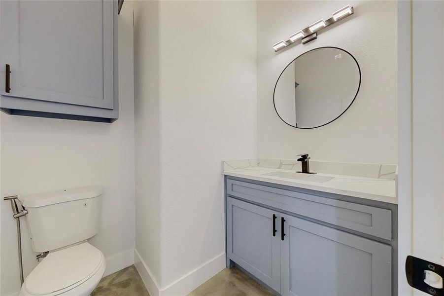 Bathroom with vanity and toilet