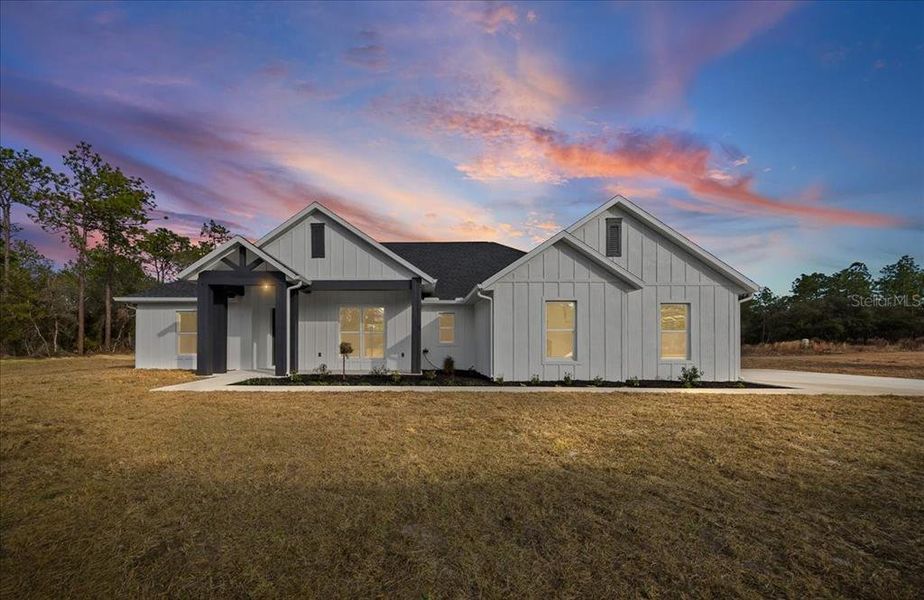 Front exterior of a new home in , Ocala, FL, highlighting curb appeal (Image 29).