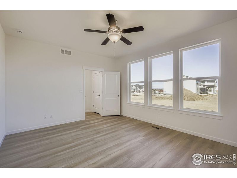 Spacious, unfurnished interior of a new home in RainDance - 60s, Windsor (Image 18).