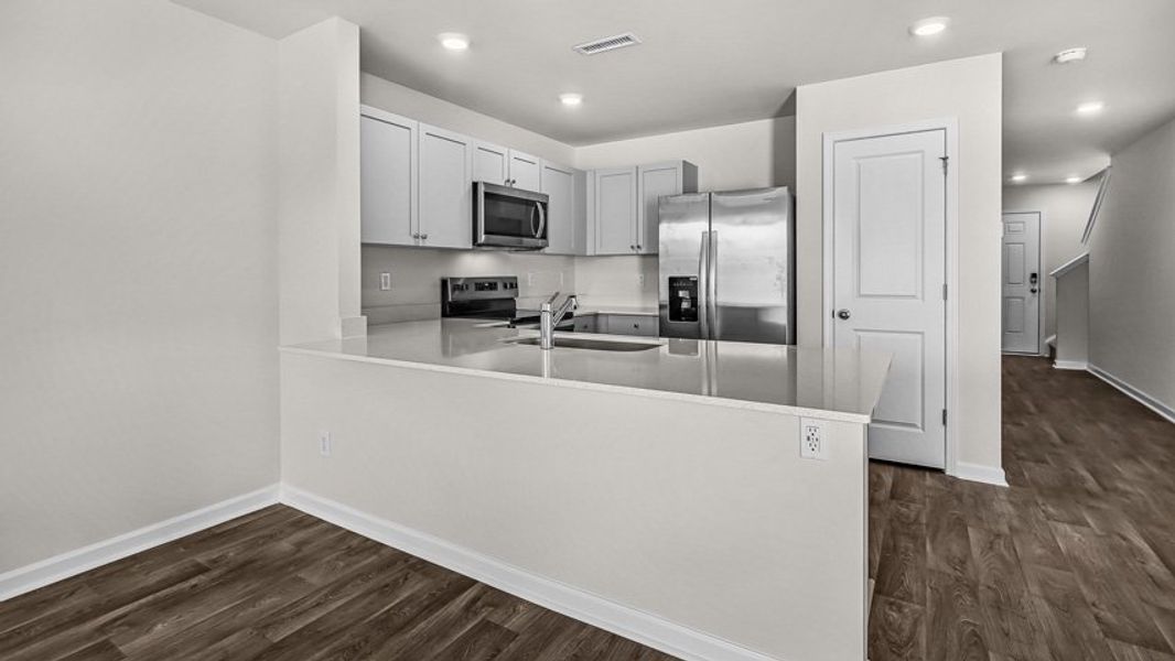 Furnished interior view inside a new home in Edinborough Townes, Gibsonville (Image 5).