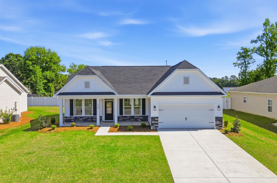 Front exterior of a new home in Oak Hollow, Longs, SC, highlighting curb appeal (Image 22). Front exterior of a new home in Oak Hollow, Longs, SC, highlighting curb appeal (Image 22).
