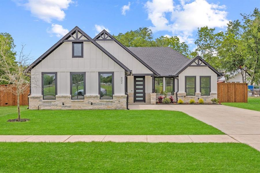 View of front of property featuring stone siding, board and batten siding, and roof with shingles View of front of property featuring stone siding, board and batten siding, and roof with shingles