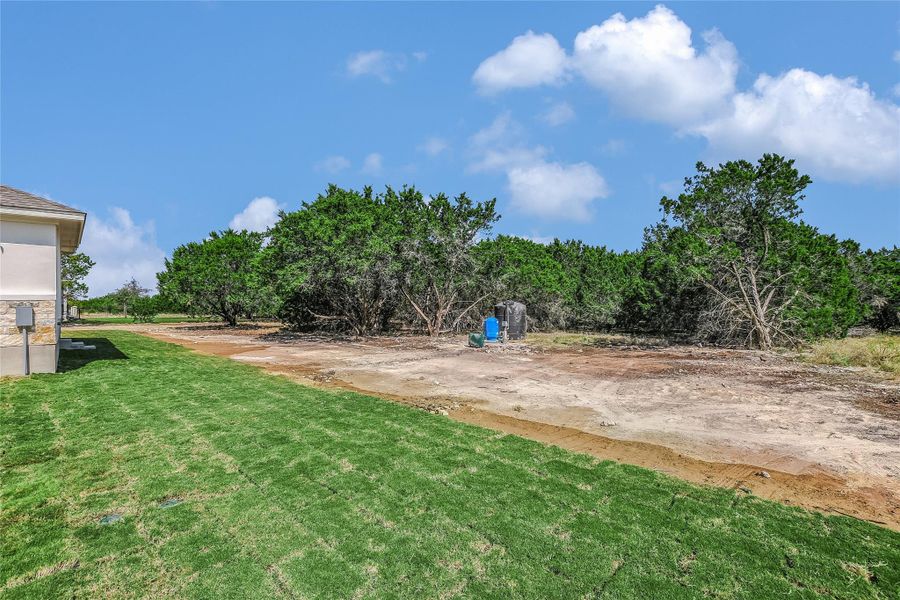 Front exterior of a new home in , Burnet, TX, highlighting curb appeal (Image 17).