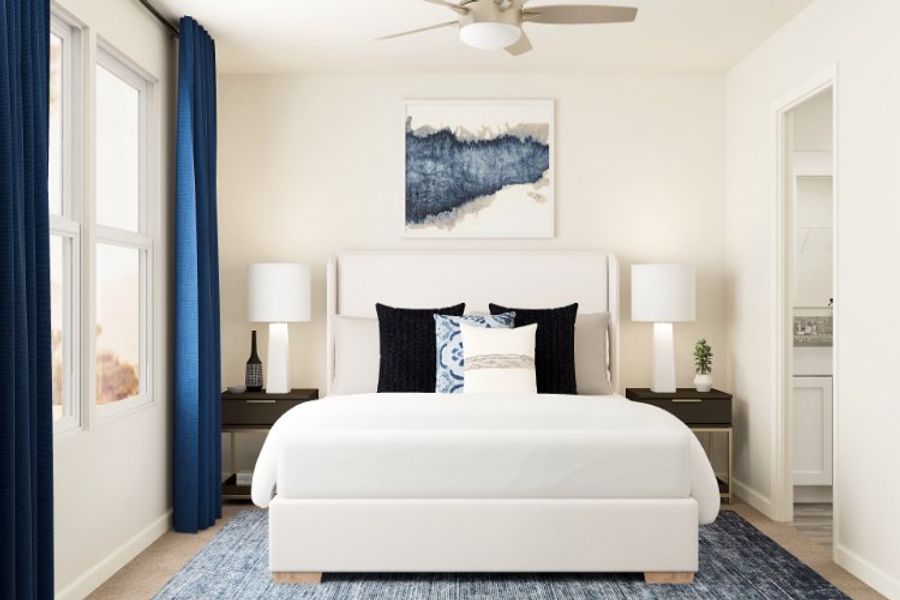 A bedroom with a bed and lamps.