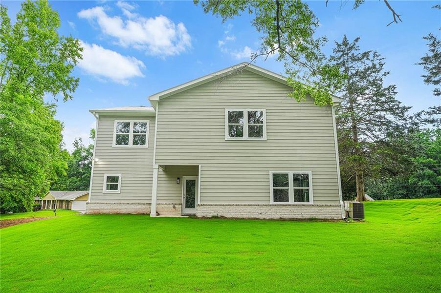 Front exterior of a new home in , Stockbridge, GA, highlighting curb appeal (Image 28).