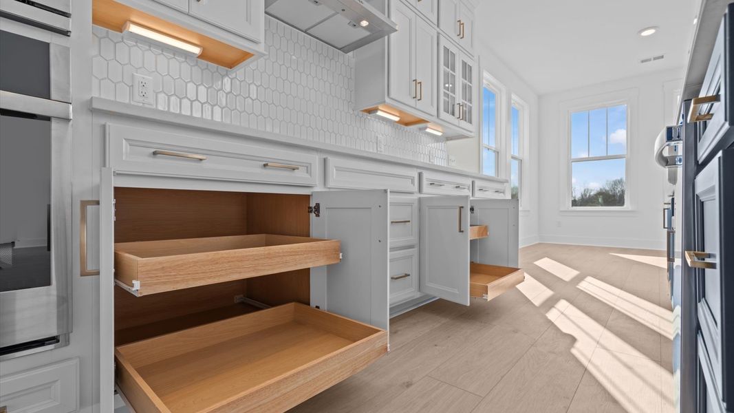 Exceptional culinary space with a striking 9-foot island and eye-catching pendant lights