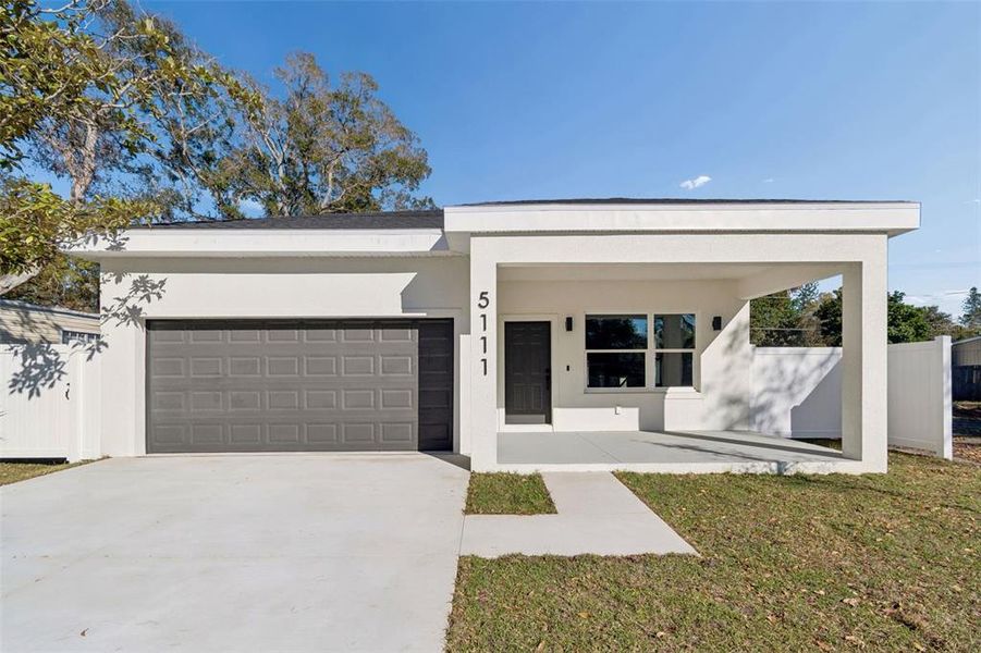 Front exterior of a new home in , St. Petersburg, FL, highlighting curb appeal (Image 1). Front exterior of a new home in , St. Petersburg, FL, highlighting curb appeal (Image 1).