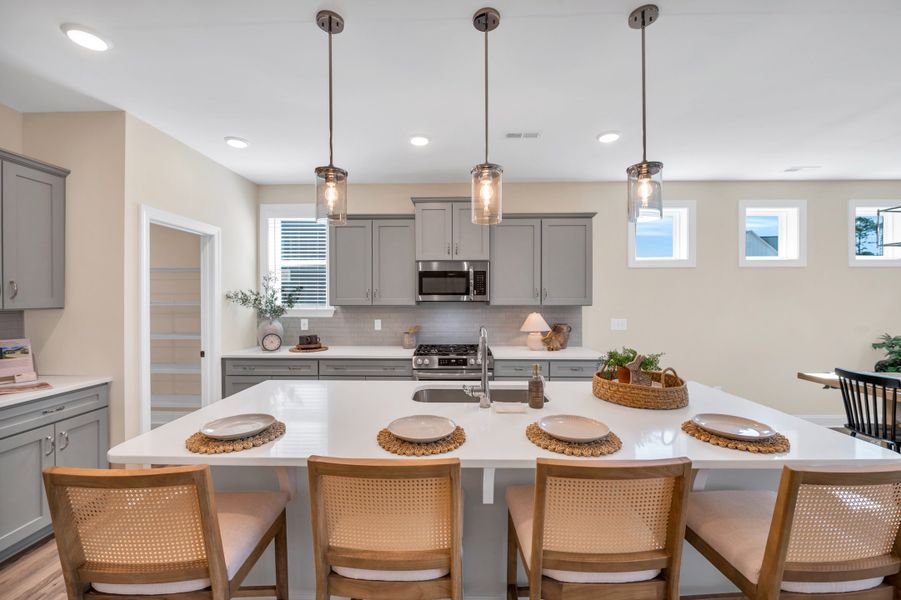 Representative furnished interior of a home built from the The Amherst by RobuckHomes in Windwater, Hampstead (Image 46).