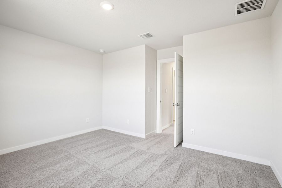 A hallway with white walls.