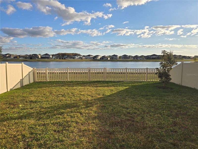 Exterior details and patio area of a home in Bryant Square: The Manors, New Port Richey (Image 3).