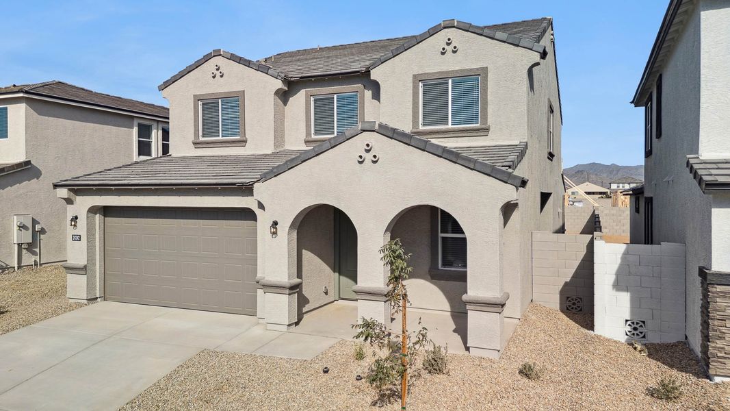 Front exterior of a new home in Apache Farms, Buckeye, AZ, highlighting curb appeal (Image 21).