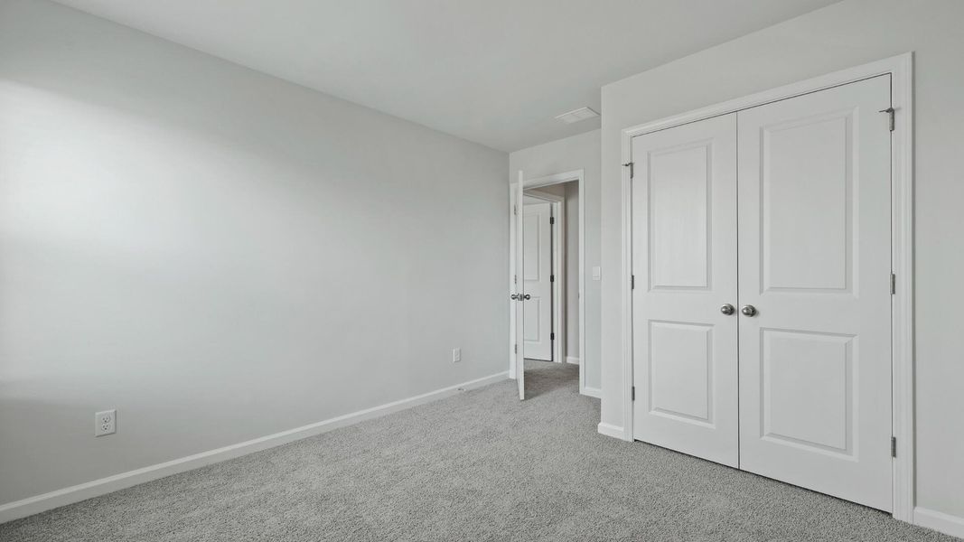 Spacious, unfurnished interior of a new home in Pine Hills at Cane Bay, Summerville (Image 11).