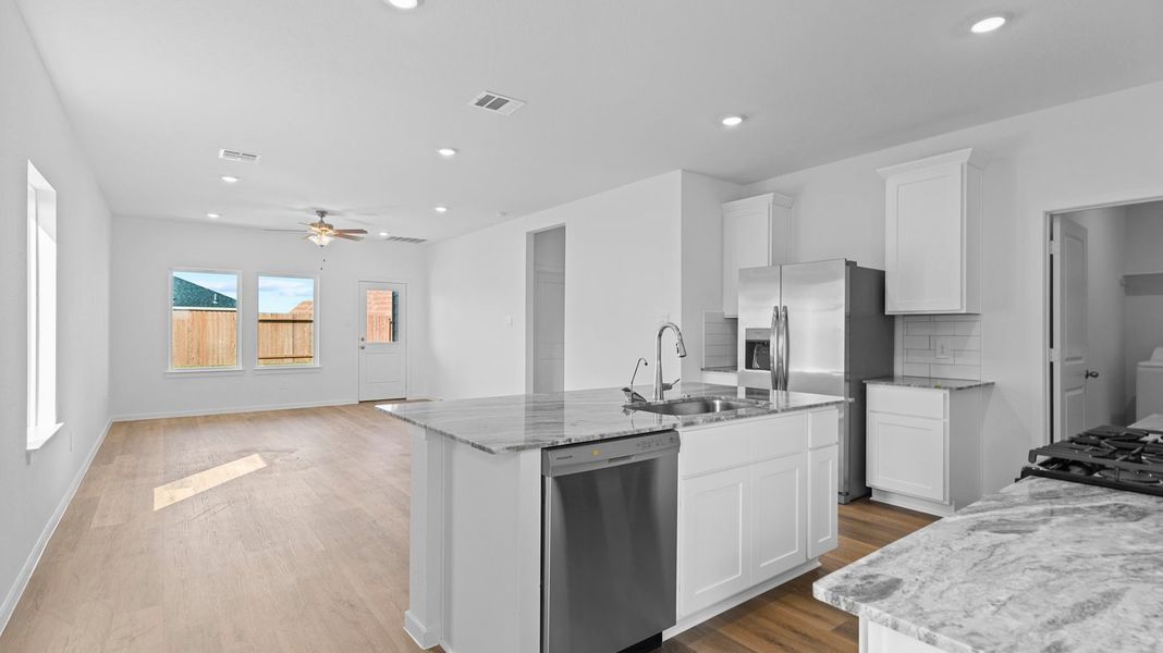 Representative furnished interior of a home built from the Hanna by D.R. Horton in Caldwell Crossing, Iowa Colony (Image 4).