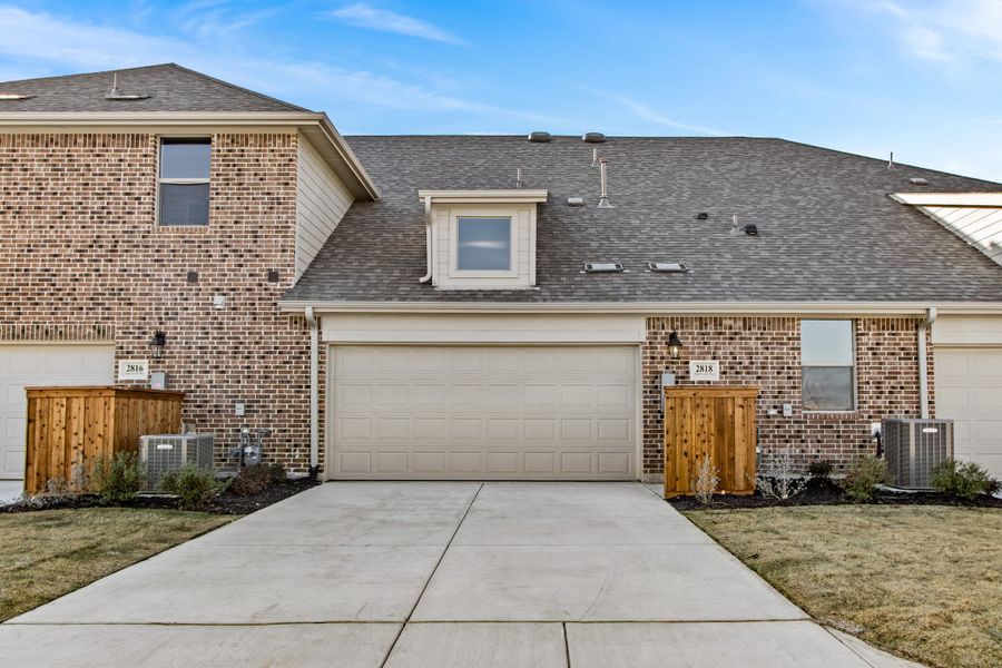 Front exterior of a new home in Woodbridge Villas, Wylie, TX, highlighting curb appeal (Image 25). Front exterior of a new home in Woodbridge Villas, Wylie, TX, highlighting curb appeal (Image 25).