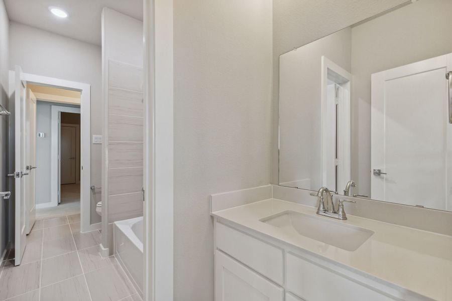 Bathroom in the Picasso II home plan by Trophy Signature Homes – REPRESENTATIVE PHOTO