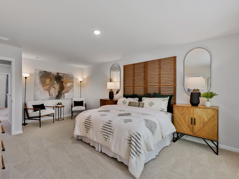 Unwind in the spacious primary suite featuring an ensuite bath, dual sinks and a walk-in closet.