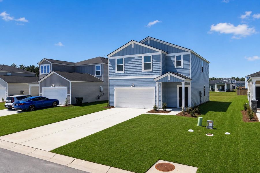 Front exterior of a new home in Lindera Preserve at Cane Bay Plantation, Summerville, SC, highlighting curb appeal (Image 15).