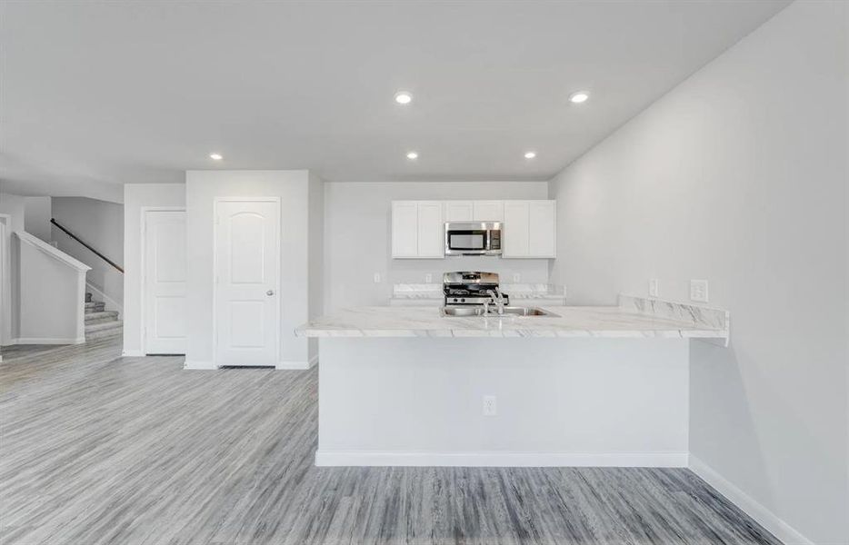 Furnished interior view inside a new home in Still Water Lake, Godley (Image 6).