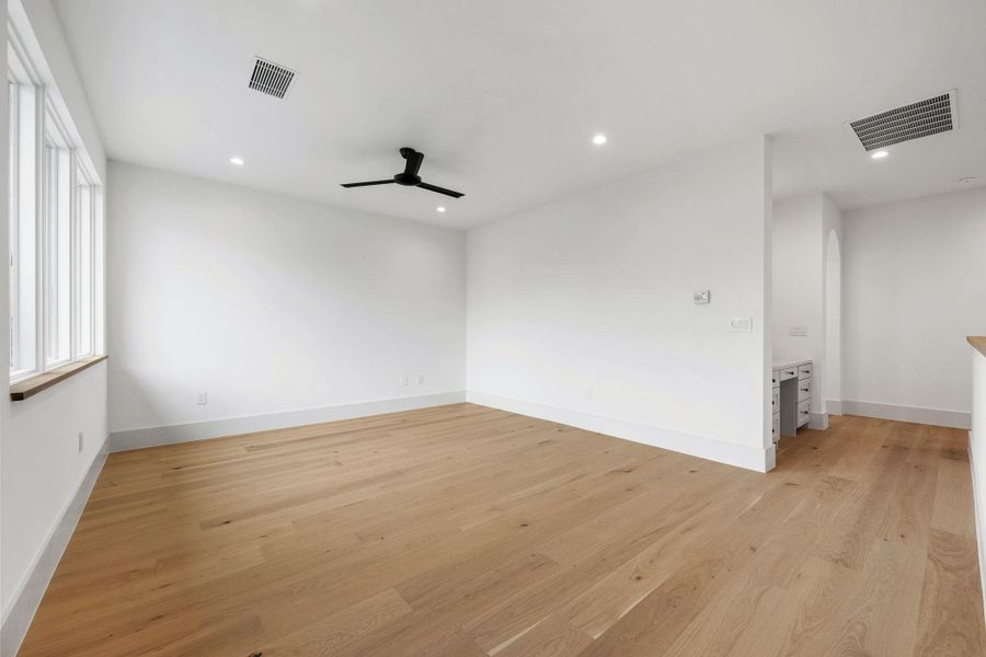 Empty room with light wood-style floors, recessed lighting, and ceiling fan Empty room with light wood-style floors, recessed lighting, and ceiling fan
