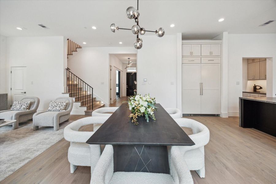 Dining space is located directly off of the living. Ample windows and a set of French doors fill this space with light. Dining space is located directly off of the living. Ample windows and a set of French doors fill this space with light.