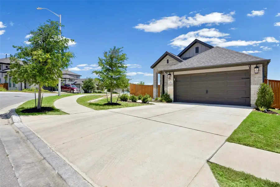 Front exterior of a new home in , Kyle, TX, highlighting curb appeal (Image 24). Front exterior of a new home in , Kyle, TX, highlighting curb appeal (Image 24).