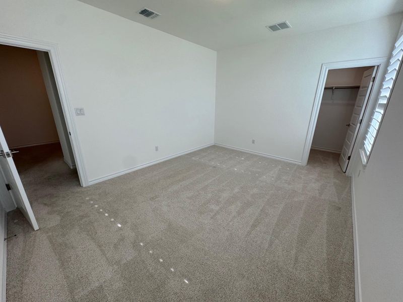 Bedroom 5 with full bath just outside the door and walk in closet.