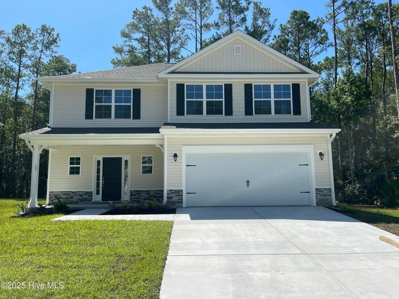 Front exterior of a new home in Mill Creek Cove, Bolivia, NC, highlighting curb appeal (Image 1).