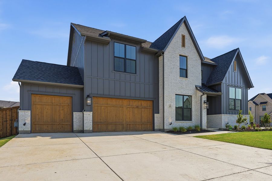 Front exterior of a new home in Light Farms Graham/Reagan, Celina, TX, highlighting curb appeal (Image 27).