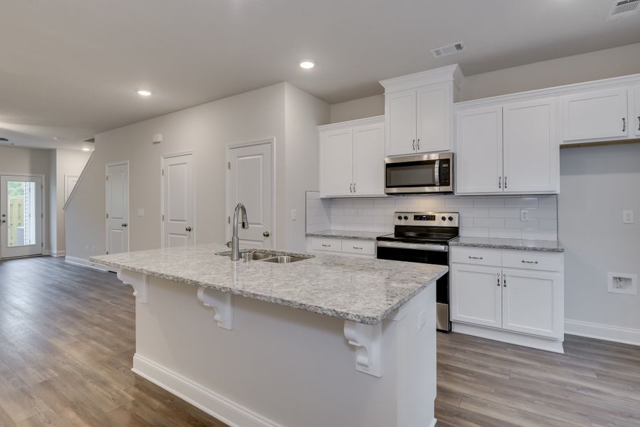 Spacious 2-Bedroom Athens Plan Kitchen at 627 Hampton Drive, Windsor - Ivey Homes Spacious 2-Bedroom Athens Plan Kitchen at 627 Hampton Drive, Windsor - Ivey Homes