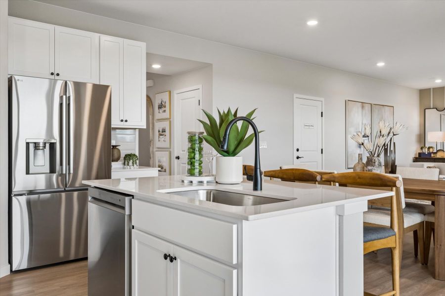 A kitchen with white cabinets. A kitchen with white cabinets.