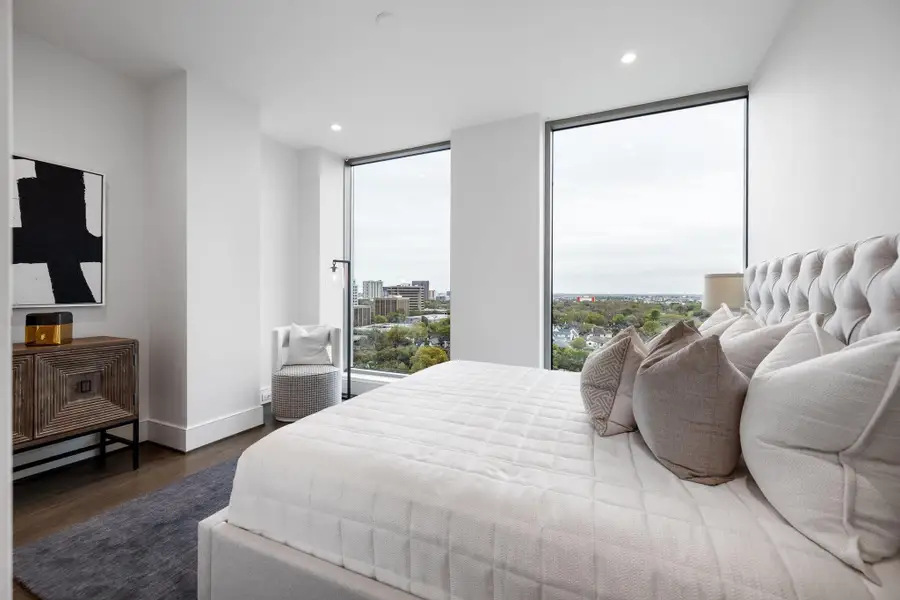 Primary bedroom with floor to ceiling windows. Primary bedroom with floor to ceiling windows.