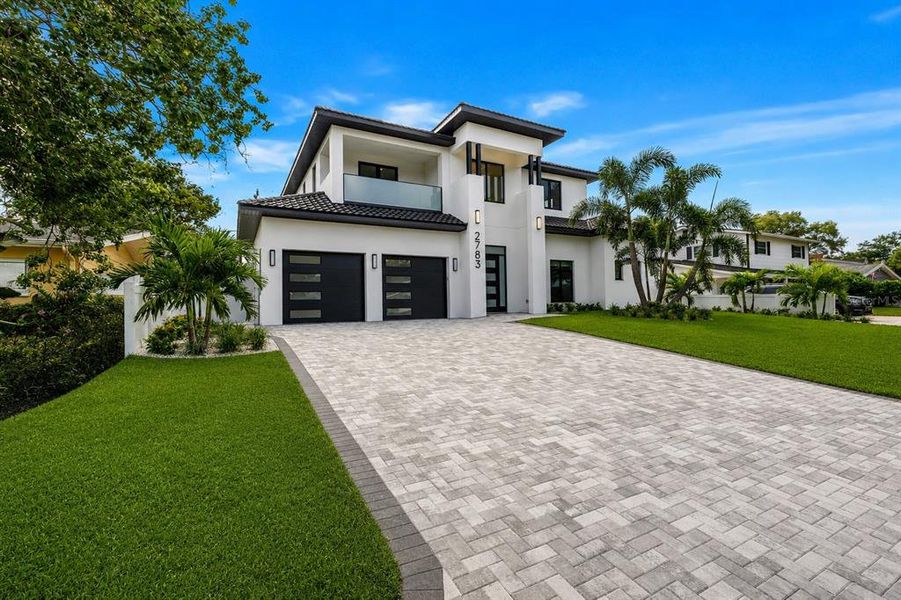 Front exterior of a new home in , St. Petersburg, FL, highlighting curb appeal (Image 1). Front exterior of a new home in , St. Petersburg, FL, highlighting curb appeal (Image 1).
