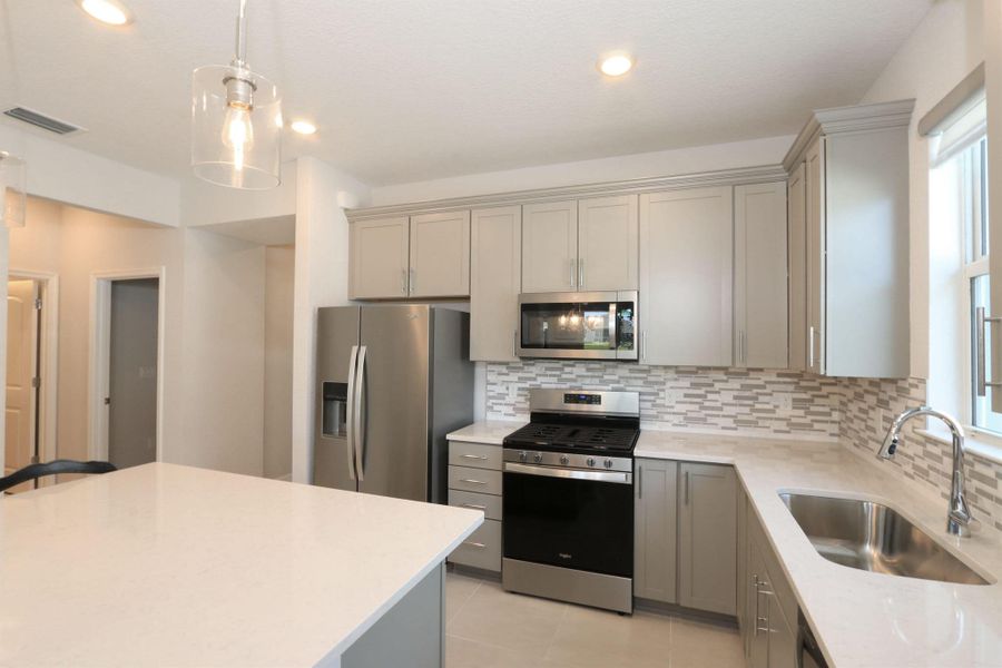 Furnished interior view inside a new home in Del Webb Tradition, Port St. Lucie (Image 30).