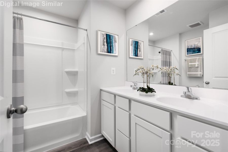 Soak, unwind, and get ready in style! This spa-inspired bath features a relaxing tub, dual vanities, and tons of storage — your daily escape starts here!